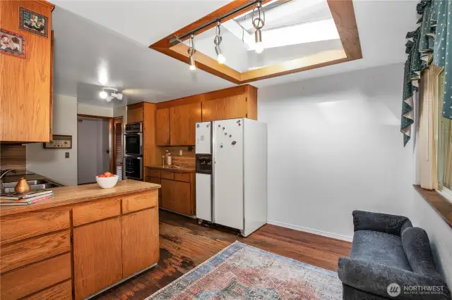 The kitchen is functional and could be expanded if you are planning on a remodel.
