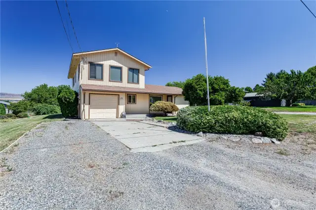 Front of home and 1 car attached garage