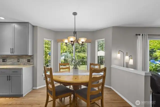 Framed by windows, the kitchen and family room look out onto nothing but trees and tranquility.