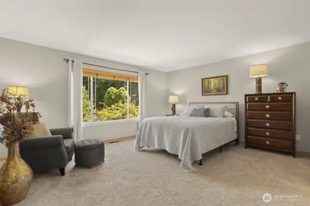 The generously sized primary bedroom offers plenty of space to unwind—your own private retreat at the end of the day.