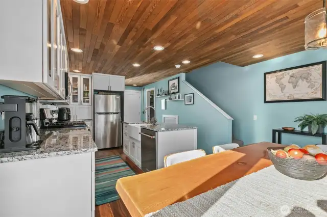 The owners renovated the culinary kitchen with sleek granite, crisp white cabinets & a big prep island.