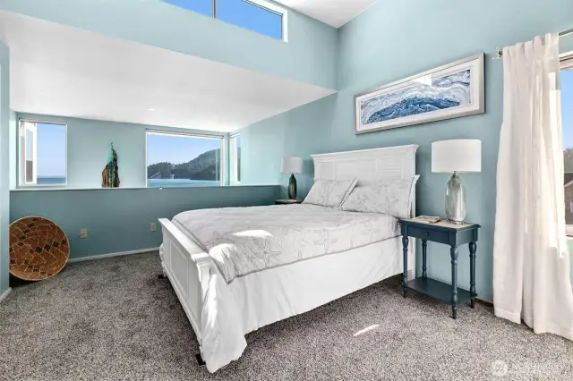 This is the upper level, large, primary suite. Light and bright with tranquil views.