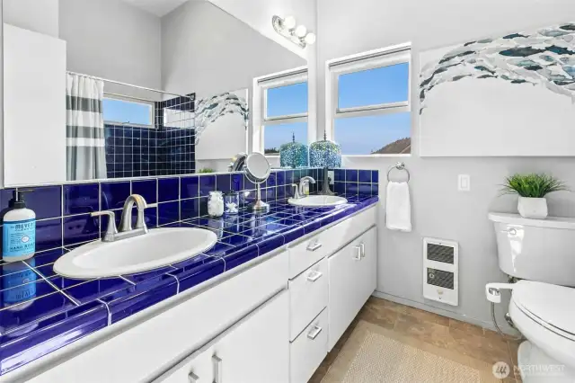Dual sinks in the primary suite. A full bath with a view!