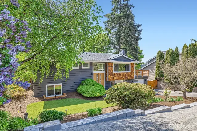 Excellent year-round curb appeal. New, contemporary shingles and parking pad.