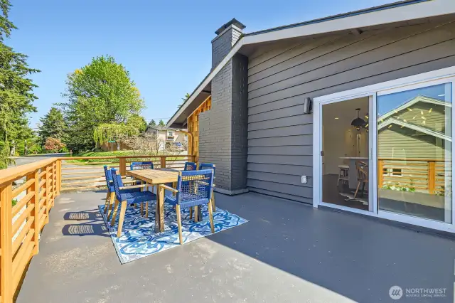 Right off the kitchen, imagine relaxing with family and friends on your rooftop deck.