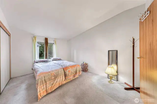 The primary bedroom features vaulted ceilings, plush carpet, and generous natural light—offering a peaceful retreat within Lake Samish Terrace. Just minutes from the lakefront, this Bellingham 55+ manufactured home is as comfortable as it is convenient.