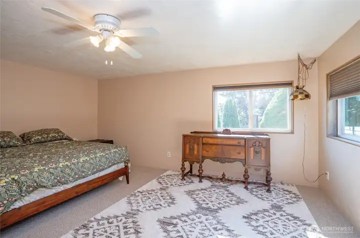 The primary suite offers ample room for a sitting area and offers a relaxing, personal retreat.