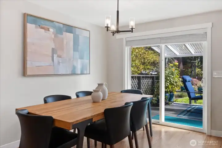 The sliding door (installed in 2019) joins the indoor and outdoor dining areas!