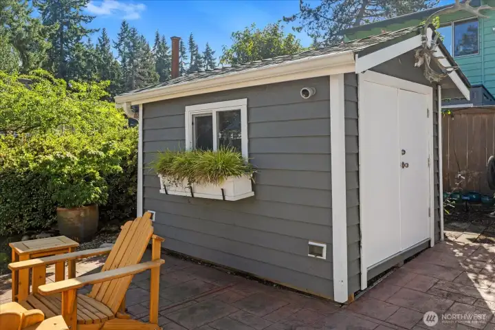 The insulated shed, offering heat and electricity, is perfect for storage.