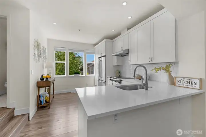 Tall west-facing windows make this unit bright and welcoming.