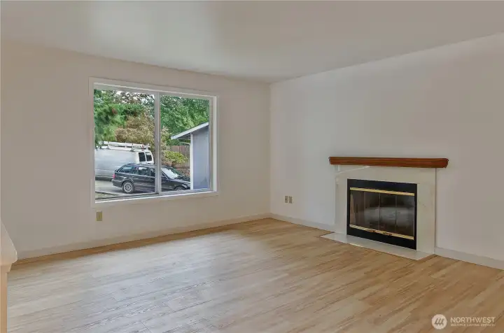 Open living room with fireplace.