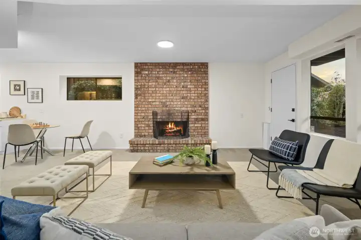 This rec room is located on the lower floor and can be accessed directly from either the front yard, or via the bedroom on the same level. It can be enjoyed as a rec room for the family or as part of a separate unit with it's own bedroom, full bathroom, and small kitchen. A wood burning fireplace keeps everyone warm even when the power is out.