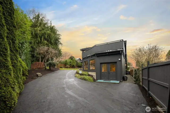 The gated back entry has plenty of parking, and convenient access to the pool room, or walk across the back yard to the family room and kitchen entry at the covered rear deck. You can also access the back entry to the lower floor's bedroom and rec room area.    The back yard is fenced except for the side yard at the front which can be easily done.