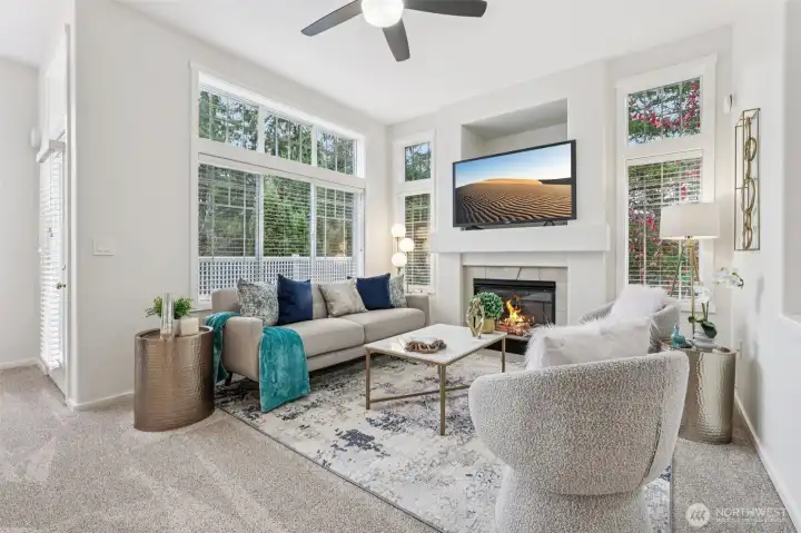 Impressive tall ceilings, numerous windows, ceiling fan, gas fireplace