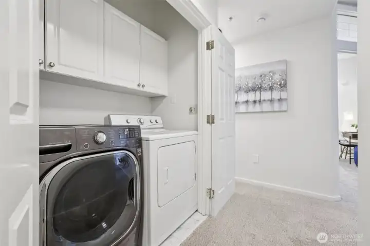 Full Washer and Dryer with shelves.  New laminate tiled floor.