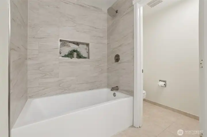 Renovated primary soaking tub and shower