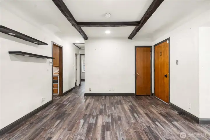 Looking toward the front door and the hallway leading to 2 bedrooms.