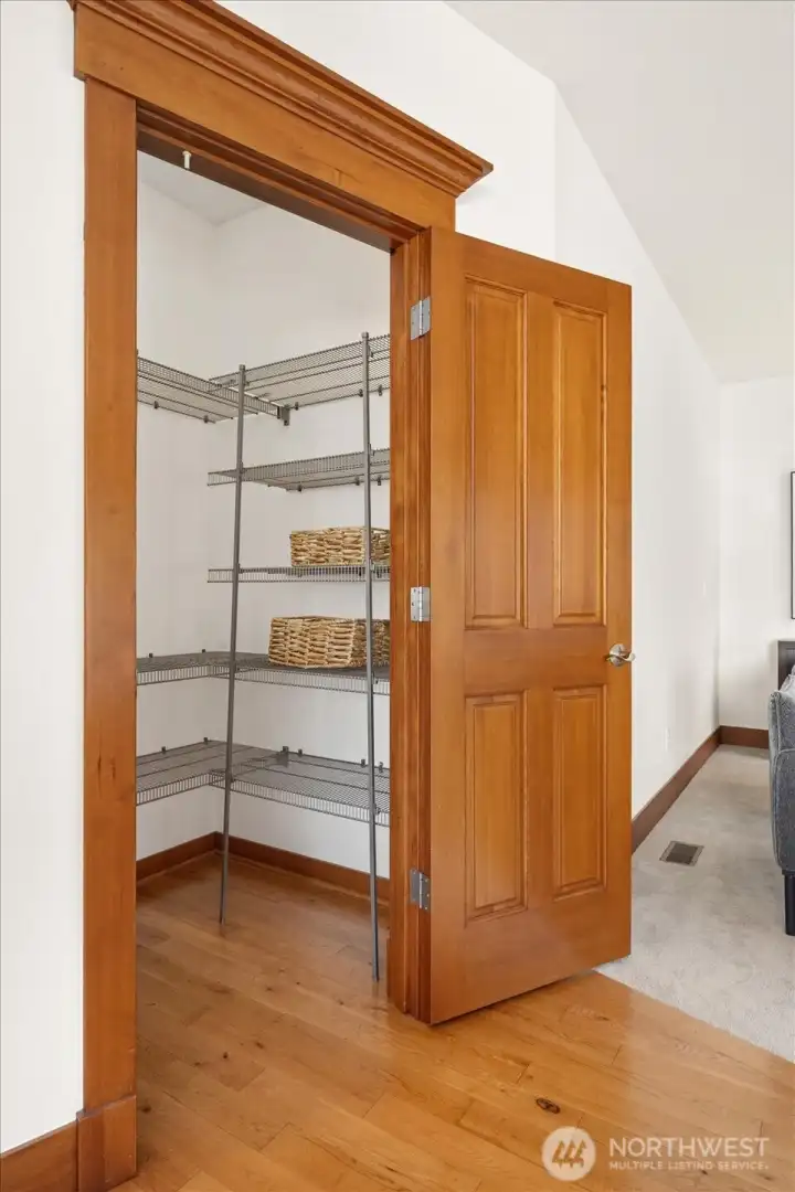 One of two (Yes, two!) walk-in pantries - both feature built-in shelving! An added bonus and a delight for storage options!