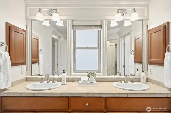 Here is another example of coveted Burnstead detailing and trim work. Added bonus: dual vanities and large cabinetry.