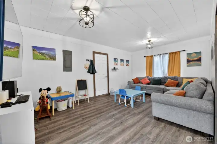 This is the large family room with updated fixtures and laminate flooring.