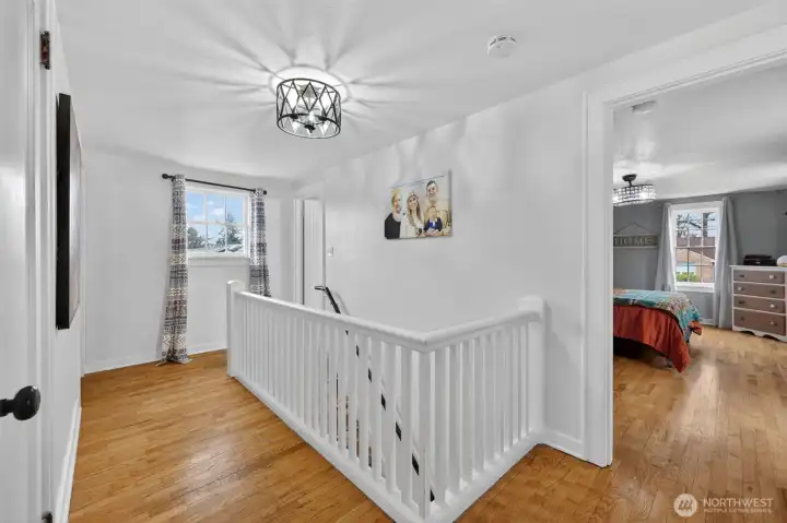 Upstairs landing, also hardwood flooring upstairs.