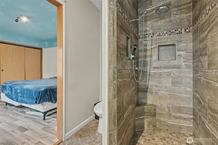 Primary Bath - nicley tiled shower and fixtures.
