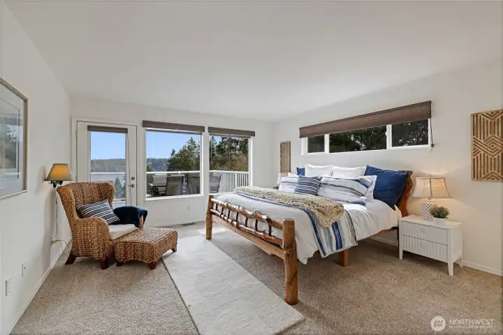 The large primary bedroom has its own access the the deck!