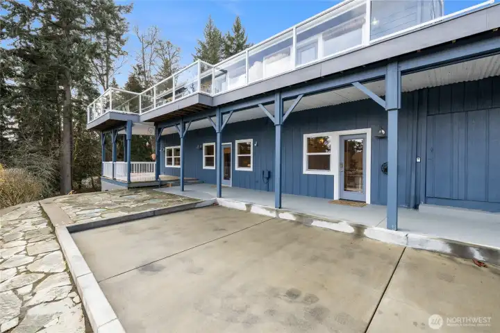 This is the allocated parking area for the lower unit. Straight ahead is the entrance & covered patio