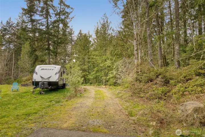 Driveway installed, half paved then turning to gravel.