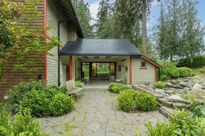 Covered patio with storage across the way for...