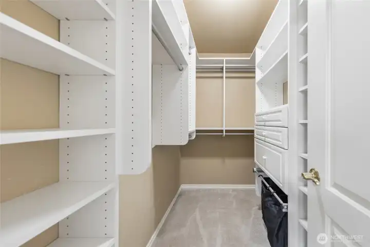 Walk-in closet in primary bedroom.