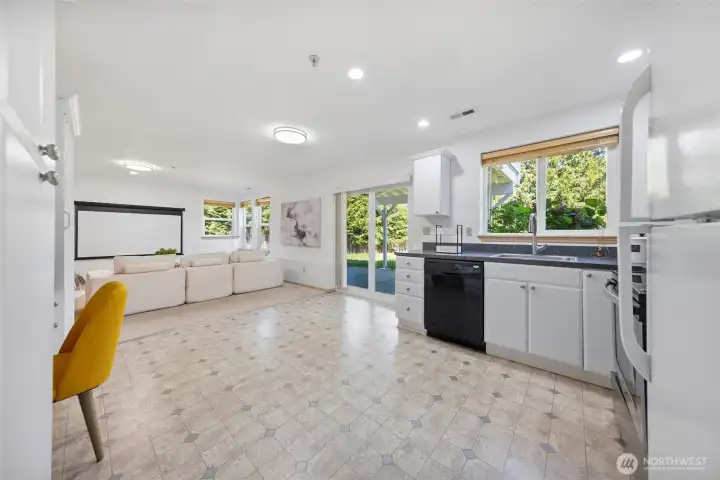 living space on lower level, with sliding door to patio.