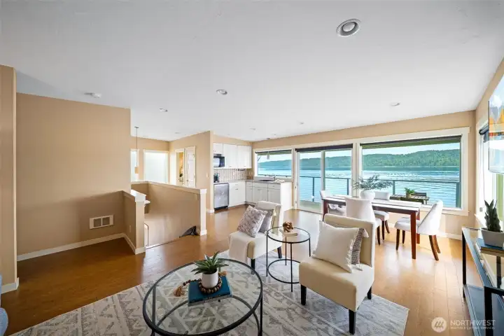 2nd Floor Great Room and Kitchen with wall of windows and access to full length deck