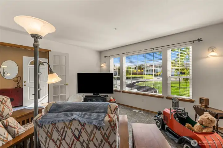 Right off the entry.  Big bright windows.