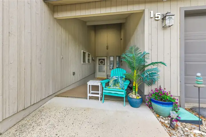 Covered entry with seating space.