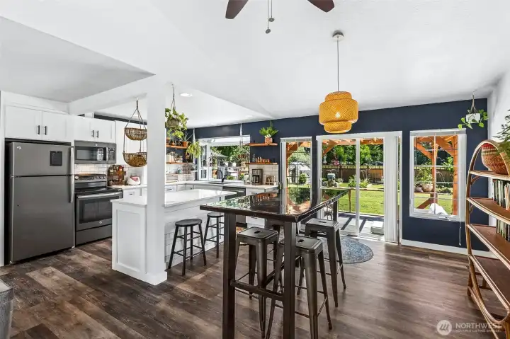 Eat-in Kitchen with Island and Garden Window + Dining Area