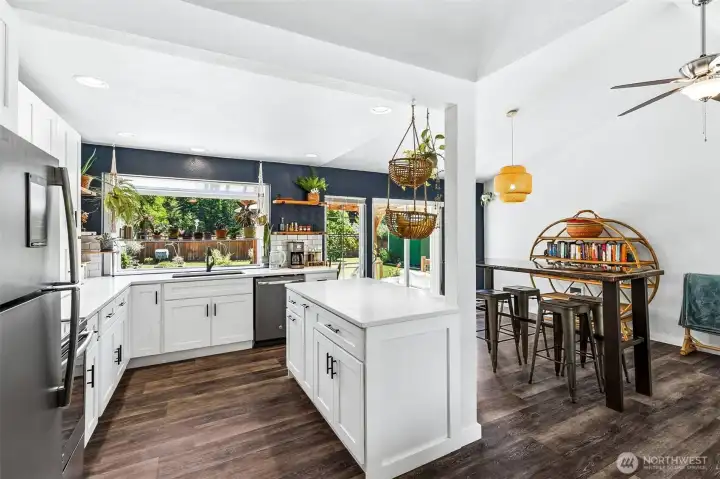 Eat-in Kitchen with Island and Garden Window + Dining Area