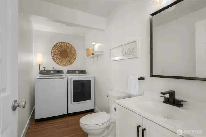 Large 1/2 bath includes laundry room.