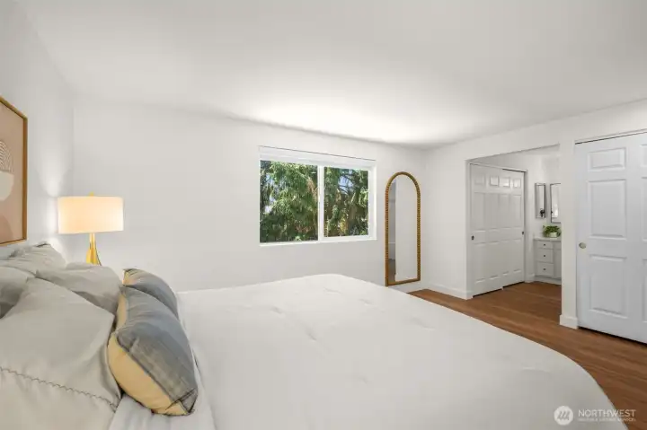 Primary bedroom w/2 closets & en suite bathroom.