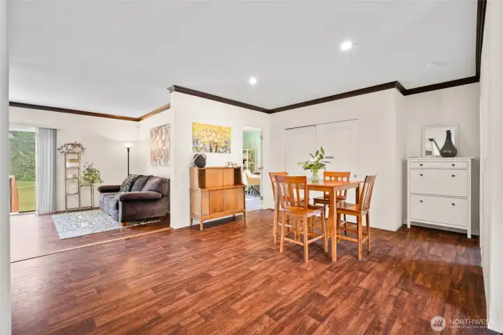 Perfect breakfast nook location, that opens to the kitchen, second living room area, and two doorways going to the office space and the primary bedroom suite.