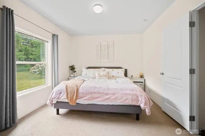 This is one of two primary suites. Each are located on opposites sides of the home.