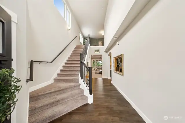 View as you enter the home. Generous entry hall, wide staircase, loft at the top of the stairs