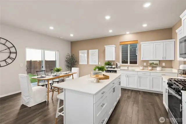 Kitchen. Photos are of model home of the same plan and may reflect different colors and options.