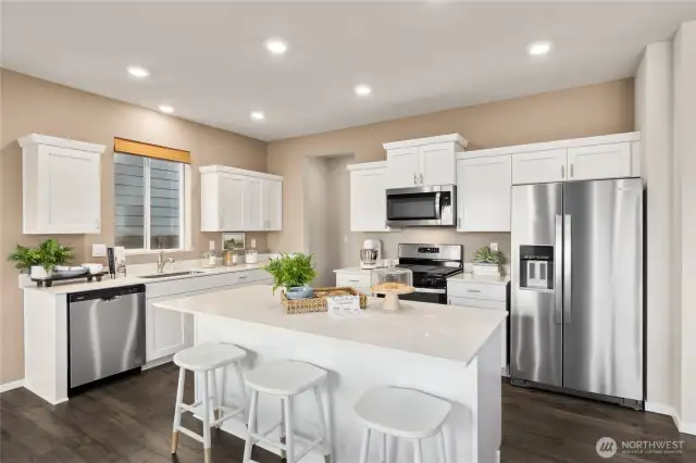 Kitchen. Photos are of model home of the same plan and may reflect different colors and options.