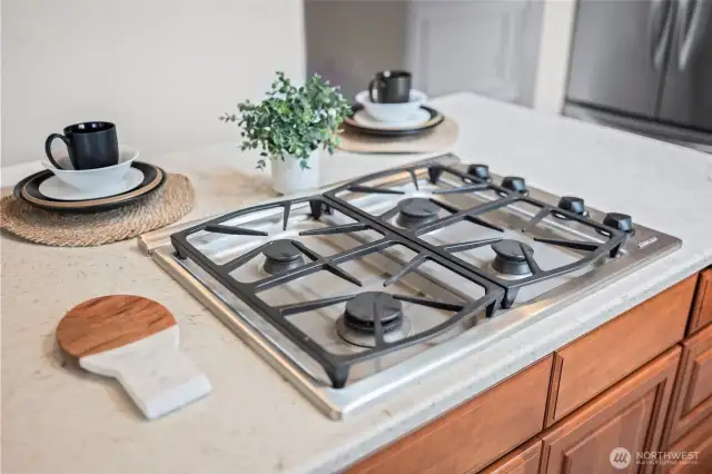 Kitchen with updated cabinets, tile and countertops