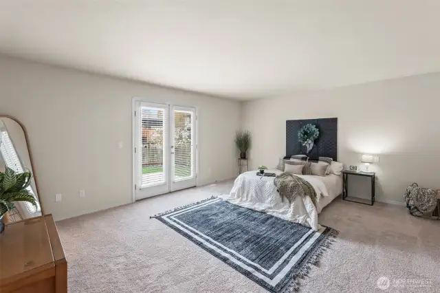 Primary bedroom with French Doors to Backyard