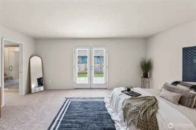 Primary bedroom with French Doors to Backyard