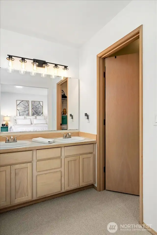 Walk in closet in the primary bedroom.