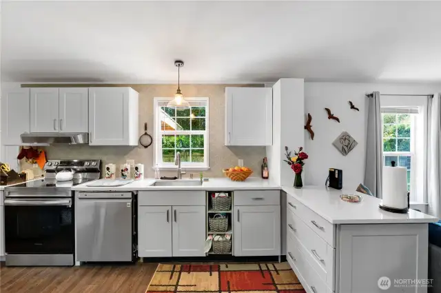 Light filled Kitchen with plenty of storage with the beautiful newer cabinetry