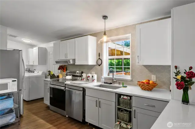 Bright Kitchen with stunning cabinetry & quartz countertops